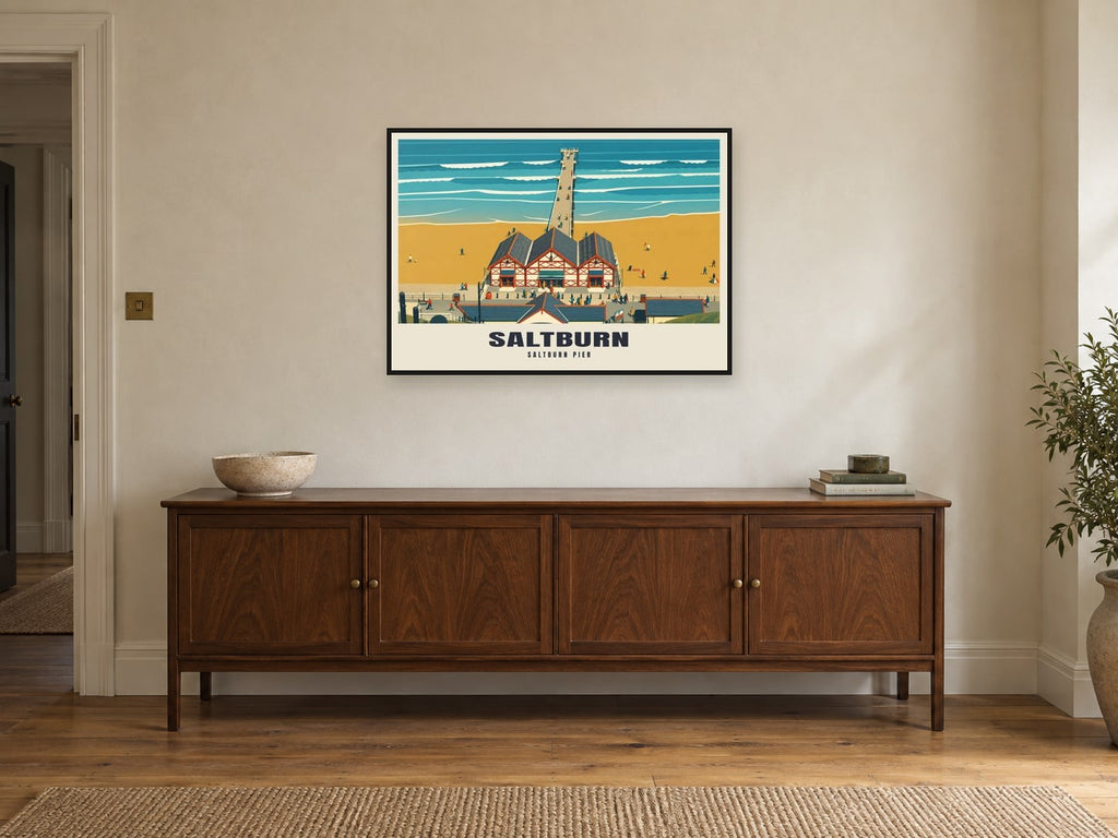 Saltburn Pier Poster at A1, in a black frame, above a sideboard